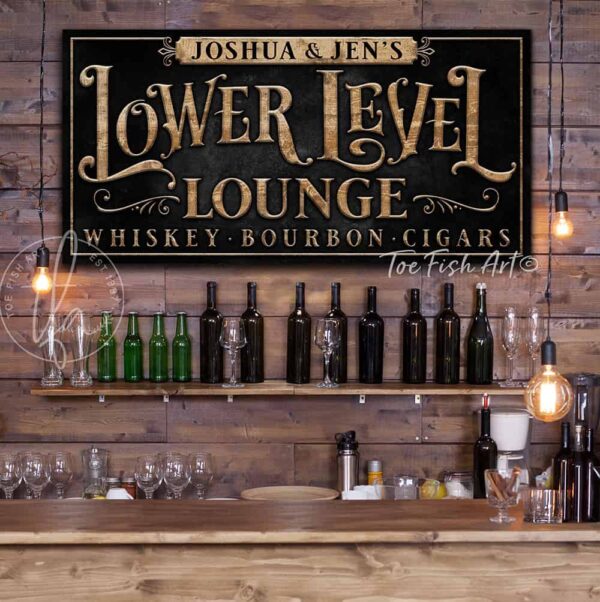 Toe Fish Art Lower Level Lounge Canvas or Outdoor Metal Personalize-able Custom Sign, Slate Black, Rustic Gold lettering, Knotty Tan Woodgrain Lettering, custom wording options, handmade by ToeFishArt. Personalize-able Canvas or Outdoor Exterior Commercial-Grade Metal Sign handmade in the USA and built to last a lifetime by ToeFishArt. Add your family name and favorite saying to this beautiful artwork for unique eye-catching appeal indoors or for your outdoor living space. Color options available. Original, custom, personalized wall decor signs. Canvas, Wood or Metal. Rustic modern farmhouse, cottagecore, vintage, retro, industrial, Americana, primitive, country, coastal, minimalist.